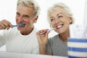 Img-blog-Senior Couple In Bathroom Brushing Teeth