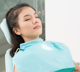 Young adult woman in examine seat