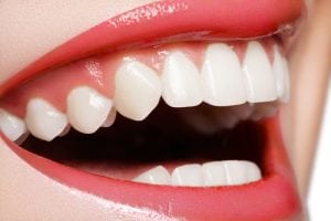 happy womans smile with healthy white teeth,