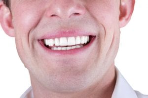 adult male smile closeup isolated on a white background-img-blog