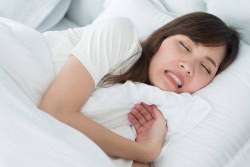 Woman Grinding her Teeth in her Sleep